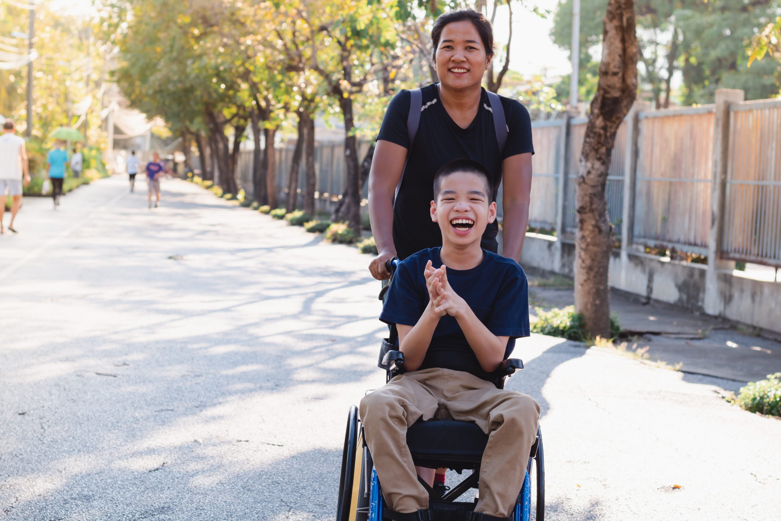 Disabled,Child,On,Wheelchair,Is,Playing,In,The,Outdoor,Park